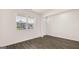 Living room with wood floors and a large window with natural light at 8593 Secretariat Dr # 20, Lithonia, GA 30058
