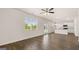 Open living space featuring wood flooring, natural light, a ceiling fan, and an eat-in kitchen with stainless appliances at 8593 Secretariat Dr # 20, Lithonia, GA 30058