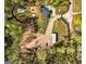 Aerial view of an estate featuring a pool, guest house, sports court, barn, and wooded surroundings at 168 Lakeview Dr, Grantville, GA 30220