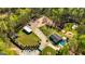 Expansive property featuring a large house, pool, guesthouse, barn, sport court, and wooded acreage at 168 Lakeview Dr, Grantville, GA 30220