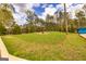 Expansive backyard features a large grassy area with mature trees creating a private outdoor oasis at 168 Lakeview Dr, Grantville, GA 30220