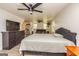 Bedroom with hardwood floors, a ceiling fan, and a large tv at 168 Lakeview Dr, Grantville, GA 30220