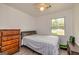 This bedroom has a ceiling fan and natural light from the window at 168 Lakeview Dr, Grantville, GA 30220