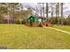 Charming green guest house with a wooden deck and a well-manicured lawn, offering a cozy retreat at 168 Lakeview Dr, Grantville, GA 30220