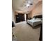 Cozy bedroom features plush carpeting, a ceiling fan, and natural light at 1132 Saint Phillips Ct # 90, Locust Grove, GA 30248