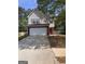 Charming two-story home features a wide driveway and attached two-car garage at 1132 Saint Phillips Ct # 90, Locust Grove, GA 30248