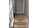 Hallway showcasing stairs with white railings leading to upper level at 1132 Saint Phillips Ct # 90, Locust Grove, GA 30248