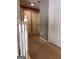 Hallway showcasing stairs with white railings leading to upper level at 1132 Saint Phillips Ct # 90, Locust Grove, GA 30248