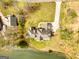 Aerial view of home with large lot, private drive, and waterfront access at 170 Austin Oaks Dr, Ellenwood, GA 30294