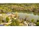 Beautiful aerial view of lakefront property with mature trees offering privacy at 170 Austin Oaks Dr, Ellenwood, GA 30294
