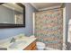 Cozy bathroom with a floral shower curtain and vanity with sink at 170 Austin Oaks Dr, Ellenwood, GA 30294