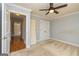Bedroom with a ceiling fan and view into the hall at 170 Austin Oaks Dr, Ellenwood, GA 30294
