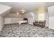 Spacious bedroom with unique patterned carpet, comfortable seating and natural light at 170 Austin Oaks Dr, Ellenwood, GA 30294