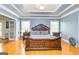 Spacious bedroom offers natural light, hardwood floors, and stylish furnishing at 170 Austin Oaks Dr, Ellenwood, GA 30294