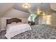 Large bedroom with patterned carpet, comfortable seating, and ample natural light at 170 Austin Oaks Dr, Ellenwood, GA 30294