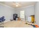 Versatile bonus room with carpet flooring, a ceiling fan, and a window, ideal for a playroom, home office, or gym at 170 Austin Oaks Dr, Ellenwood, GA 30294