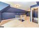 Bonus room with stairway, dark blue walls and a partial bathroom visible at 170 Austin Oaks Dr, Ellenwood, GA 30294