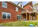 Brick exterior of home featuring a deck, large windows, and a well-maintained green lawn at 170 Austin Oaks Dr, Ellenwood, GA 30294