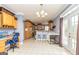 Bright kitchen featuring wooden cabinets, stainless steel appliances, and access to the backyard, offering modern convenience at 170 Austin Oaks Dr, Ellenwood, GA 30294