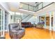 Spacious living room featuring a staircase, wood floors, and ample seating, perfect for entertaining and relaxing at 170 Austin Oaks Dr, Ellenwood, GA 30294