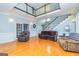 Spacious living room with wood floors, comfortable seating, and abundant natural light at 170 Austin Oaks Dr, Ellenwood, GA 30294