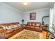 Inviting living room featuring warm wood floors, neutral paint, and stylish decor at 170 Austin Oaks Dr, Ellenwood, GA 30294