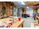 Unfinished basement with workbench and utilities offers potential for customization at 101 Westminster Way, Mcdonough, GA 30253