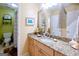 Well-lit bathroom with neutral decor, a granite countertop and an adjacent toilet at 101 Westminster Way, Mcdonough, GA 30253