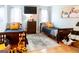 Bright bedroom featuring hardwood floors, two beds, neutral decor, and a large window at 101 Westminster Way, Mcdonough, GA 30253