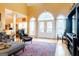 Spacious living area with high ceilings, hardwood floors, ample natural light, and a seamless flow to the outdoor space at 101 Westminster Way, Mcdonough, GA 30253