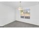 Dining room featuring a large window and neutral carpet at 5728 Rock Shoals Way, Atlanta, GA 30349