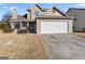 Two-story home with a two-car garage and a front porch at 5728 Rock Shoals Way, Atlanta, GA 30349