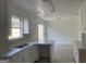 Well-lit kitchen with white cabinets and sink at 5728 Rock Shoals Way, Atlanta, GA 30349