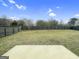 Expansive fenced backyard with a concrete patio, providing ample space for recreation and relaxation at 789 Galveston Way, Mcdonough, GA 30253