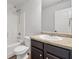 Bathroom featuring a vanity, dark cabinets, granite countertop, toilet and shower stall at 789 Galveston Way, Mcdonough, GA 30253