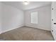Minimal bedroom design featuring carpet floors, one window and neutral color palette at 789 Galveston Way, Mcdonough, GA 30253