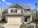 Charming two-story home featuring a brick and siding facade, a two-car garage, and well-maintained landscaping at 789 Galveston Way, Mcdonough, GA 30253
