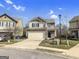 Two-story house with brick and gray siding, two-car garage, and a well-manicured lawn at 789 Galveston Way, Mcdonough, GA 30253