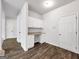 Hallway office space with built-in desk, cabinets, and LVP flooring at 789 Galveston Way, Mcdonough, GA 30253