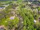 An aerial view highlighting homes amid dense trees, showcasing the secluded, wooded settings of the neighborhood at 1015 Middlebrook Dr, Mcdonough, GA 30252