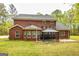 Two-story brick home has a lawn and a screened gazebo at 1015 Middlebrook Dr, Mcdonough, GA 30252