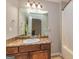 Bathroom with a grey wall, granite counter tops, mirror and a bathtub at 1015 Middlebrook Dr, Mcdonough, GA 30252