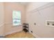 Small laundry room featuring modern hookups, a window and a wire shelf at 1015 Middlebrook Dr, Mcdonough, GA 30252