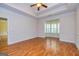 Spacious living room with hardwood floors, recessed lighting, and bright bay window at 1015 Middlebrook Dr, Mcdonough, GA 30252