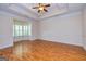 Open living area with recessed lighting, hardwood floors, and a bay window at 1015 Middlebrook Dr, Mcdonough, GA 30252