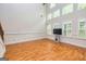 Spacious living room with hardwood floors, lots of natural light, and a soaring vaulted ceiling at 1015 Middlebrook Dr, Mcdonough, GA 30252