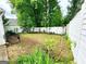 The backyard is surrounded by a white fence at 645 Crossbridge Aly, Johns Creek, GA 30022