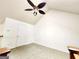 Bedroom featuring neutral carpeting, a ceiling fan, and a white door at 645 Crossbridge Aly, Johns Creek, GA 30022