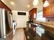 Well-equipped kitchen featuring stainless steel appliances, granite countertops, and ample cabinet space at 645 Crossbridge Aly, Johns Creek, GA 30022