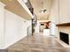 Bright living room with vaulted ceilings, spiral staircase, fireplace and hardwood floors at 645 Crossbridge Aly, Johns Creek, GA 30022